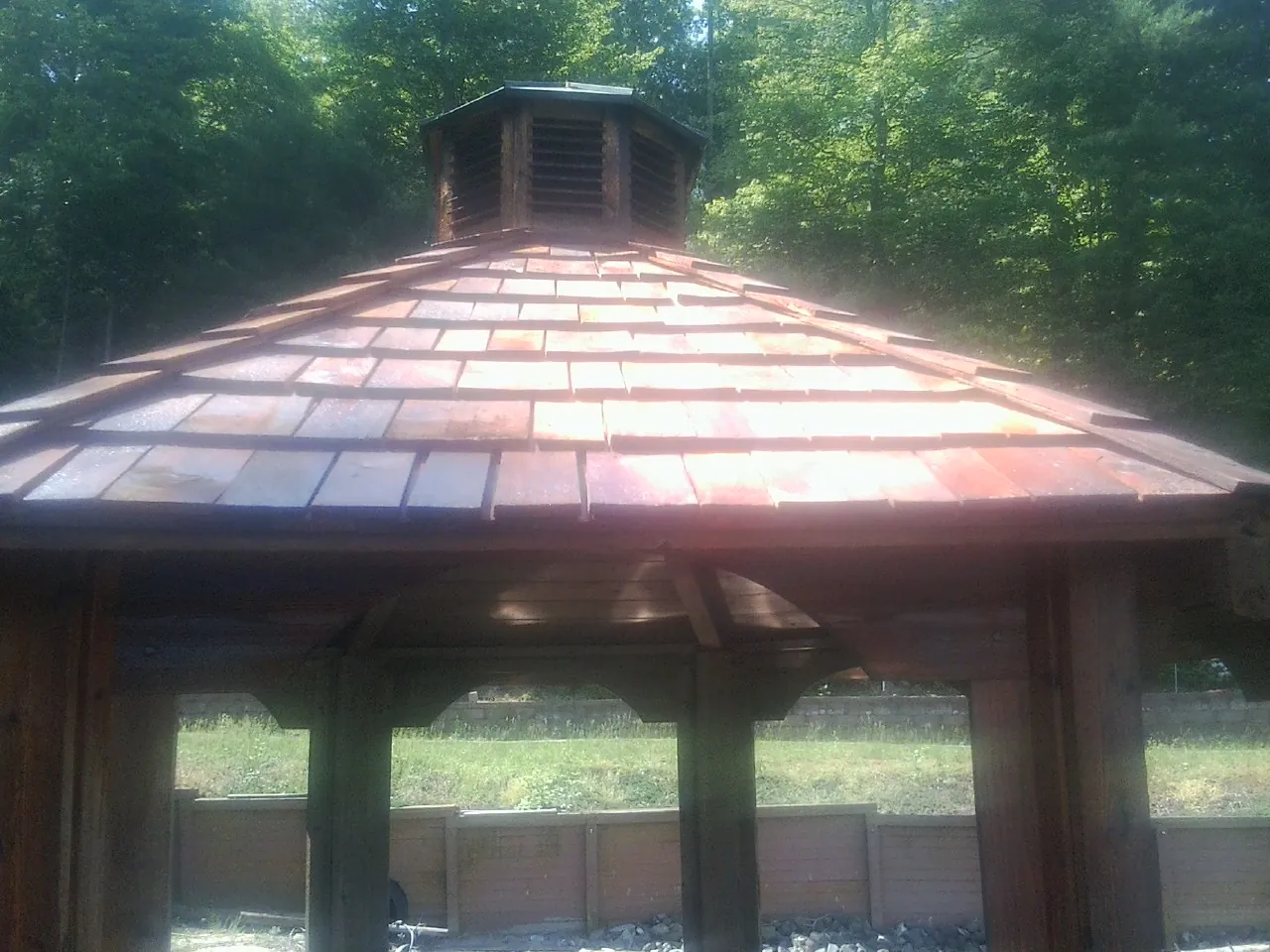 New cedar shake roof and cupola on a lakeside gazebo in Woodhaven